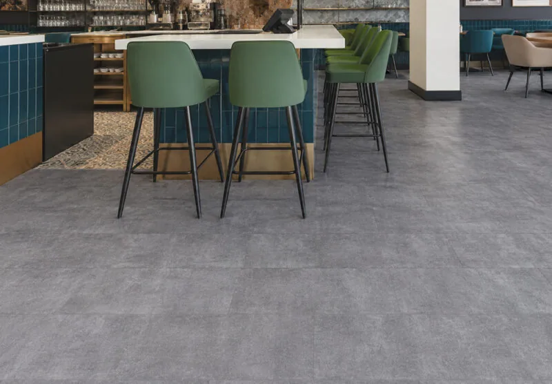 Best Waterproof &Amp; High-Humidity Flooring For Coastal, Tropical And Damp Homes Durable Gray Concrete Look Flooring In A Stylish Restaurant Or Café Bar Natural Composite Waterproof Flooring With Cork Backing