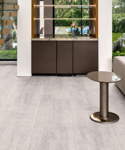 Ivory Concrete natural composite click-lock flooring with square-edge planks in a bright contemporary living room.