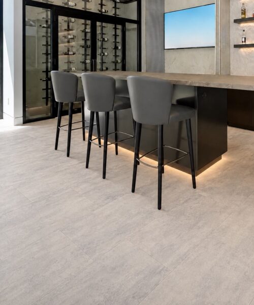 Ivory Concrete - 3/8&Quot; (9.5Mm) - Forna Natural Composite Flooring With Waterproof Hydrowood Core (Nicon9.5) Ivory Concrete Waterproof Natural Composite Flooring With Subtle Tonal Variation In A Contemporary Home Bar And Wine Room.