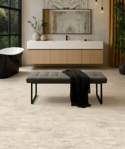 Ivory Concrete Swiss Linodesign floating flooring in a modern bathroom with freestanding tub, showing durable waterproof design ideal for basement installations