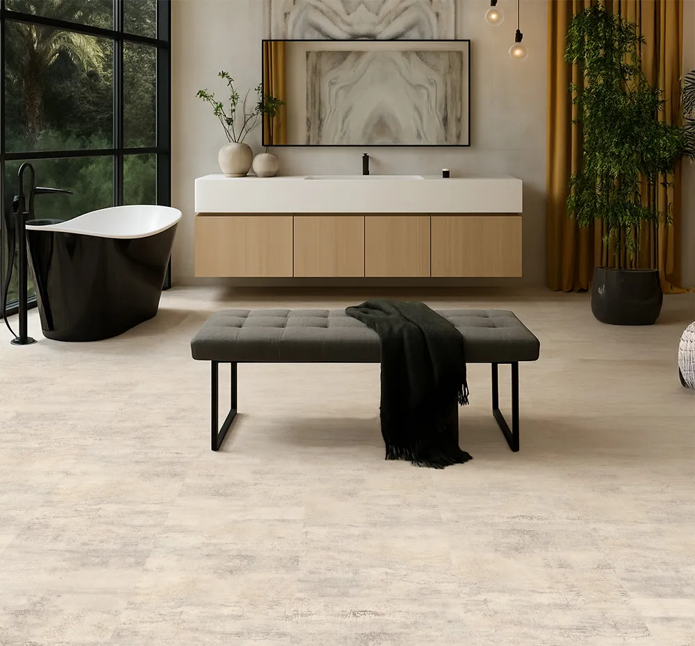 Ivory Concrete Swiss Linodesign Floating Flooring In A Modern Bathroom With Freestanding Tub, Showing Durable Waterproof Design Ideal For Basement Installations