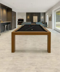 Ivory Concrete Swiss Linodesign floating flooring in a spacious basement recreation room, highlighting its waterproof, durable, and modern concrete-look surface.
