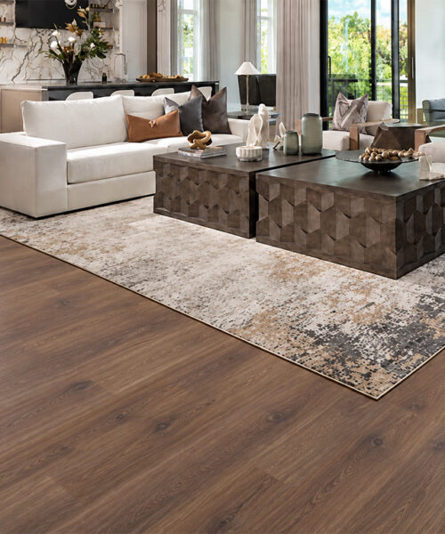Usa'S Best Cork Flooring, Wall Tiles, Underlayment And More Latte Medium-Brown Hardwood-Look Cork Floating Flooring In A Contemporary Living Room With Cream Seating, Glass Staircase, And Black Stone Fireplace.