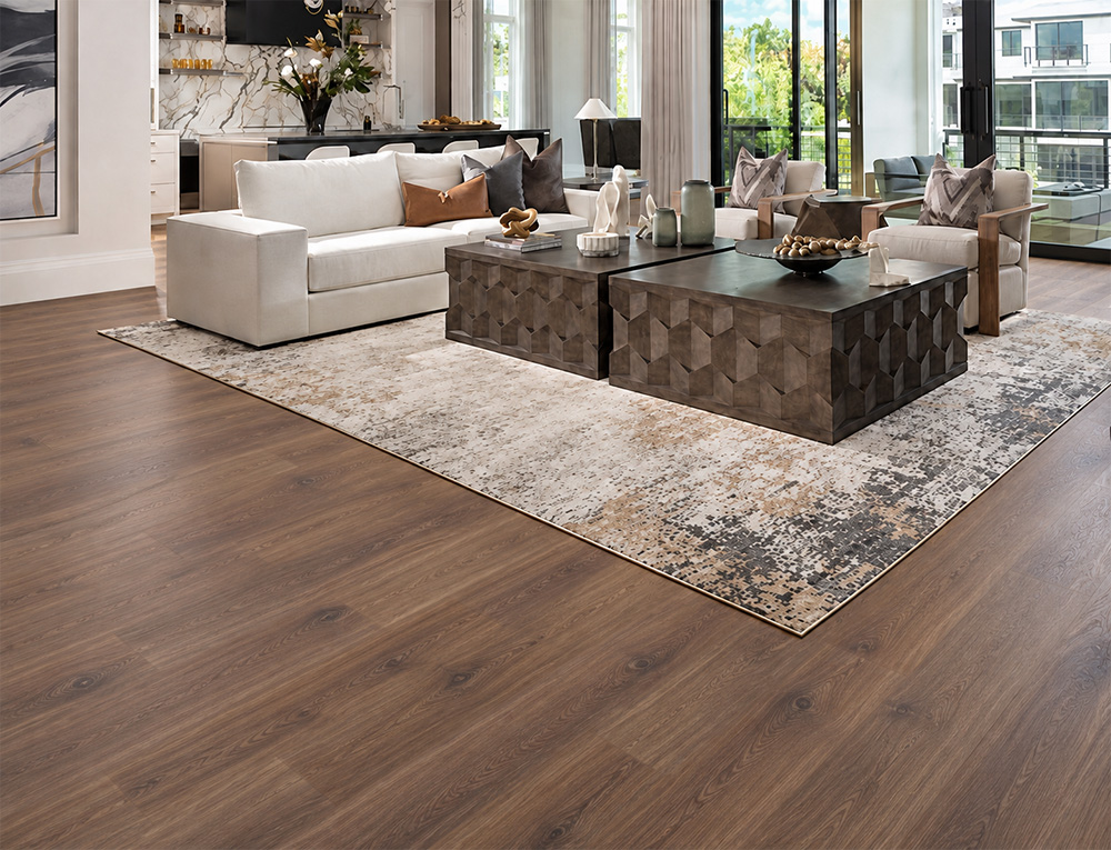 Latte - 7/16&Quot; (11Mm) - Swiss Design Cork Floating (Flat11) Latte Medium-Brown Hardwood-Look Cork Floating Flooring In A Contemporary Living Room With Cream Seating, Glass Staircase, And Black Stone Fireplace.