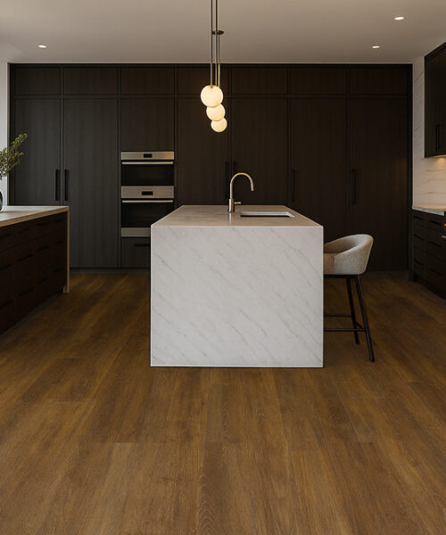 Luxury Kitchen With Latte Swiss Cork Floating Flooring, Dark Cabinets, Marble Island, And Warm Natural Lighting