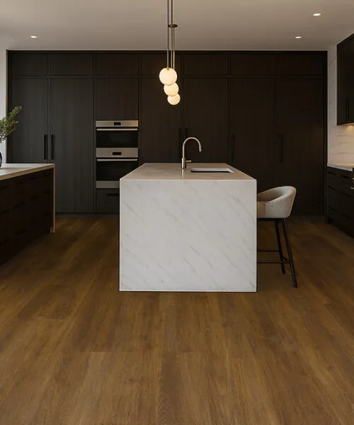 Latte - 7/16&Quot; (11Mm) - Swiss Design Cork Floating (Flat11) Luxury Kitchen With Latte Swiss Cork Floating Flooring, Dark Cabinets, Marble Island, And Warm Natural Lighting