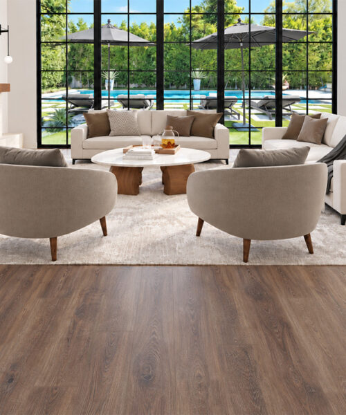 Latte - 7/16&Quot; (11Mm) - Swiss Design Cork Floating (Flat11) Warm Brown Latte Hardwood-Look Cork Flooring In A Bright Living Room With Cream Seating, A Modern Fireplace, And Outdoor Pool Views.