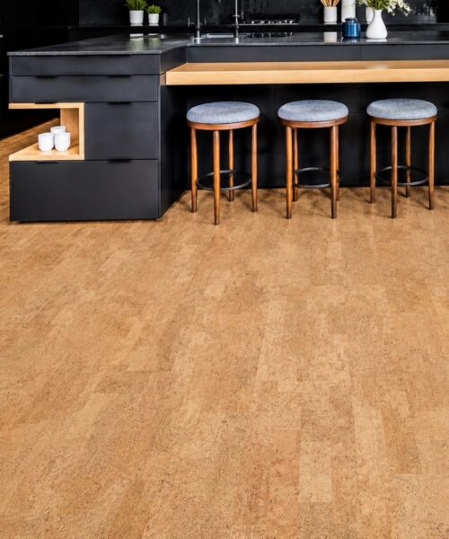 Leather Natural 12Mm Cork Floating Flooring In A Modern Black Kitchen With A Large Island And Wood Accents.
