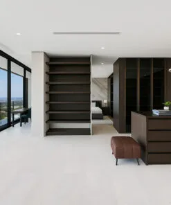 Luxury Master Bedroom With Custom Shelving And White Leather Cork Flooring Providing Comfort And Quiet Elegance.