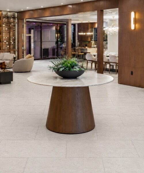 Matera Blend - 19/64&Quot; (7.5Mm) - Swiss Techslate (Mmatbd7.5) White Matera Blend Techslate Flooring Shows A Light Limestone Surface In A Rectangular Plank Layout Across An Open-Plan Dining Area.