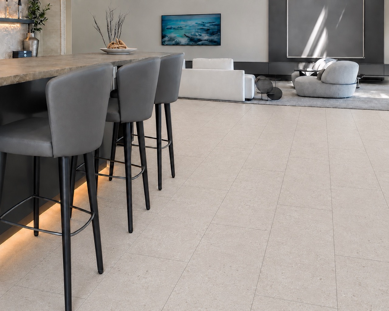 Matera Blend - 19/64&Quot; (7.5Mm) - Swiss Techslate (Mmatbd7.5) Light Limestone Matera Blend Stone-Look Flooring Extends Beneath A Kitchen Island And Into A Modern Living Room.