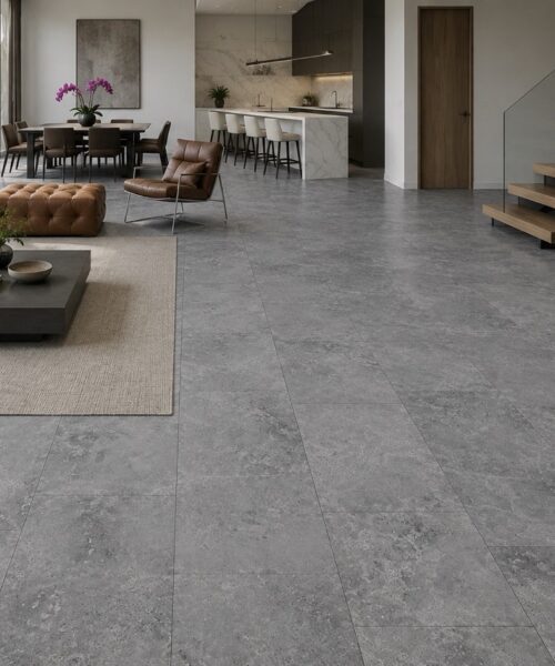 Large-Format Midnight Slate Techslate Flooring Covers A Bright Open-Plan Home With Dining Furniture, A Kitchen Island, And Floating Stairs.