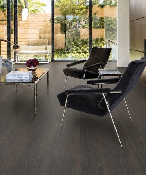 Mocha - 7/16&Quot; (11Mm) - Swiss Design Cork Floating (Fmoc11) Mocha Dark Brown Cork Floating Floor In A Modern Living Room With A Fireplace And Large Windows.