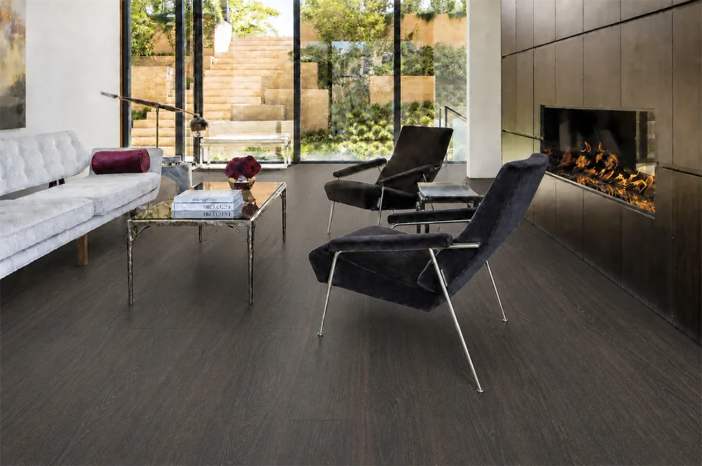 Mocha - 7/16&Quot; (11Mm) - Swiss Design Cork Floating (Fmoc11) Mocha Dark Brown Cork Floating Floor In A Modern Living Room With A Fireplace And Large Windows.