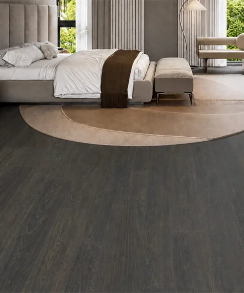 Mocha - 7/16&Quot; (11Mm) - Swiss Design Cork Floating (Fmoc11) Mocha Wood-Grain Cork Flooring In A Luxury Bedroom With Neutral Furniture And A Round Area Rug.