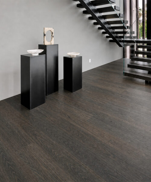 Mocha Dark Brown Floating Cork Flooring In A Traditional Hallway With A Staircase And French Doors.