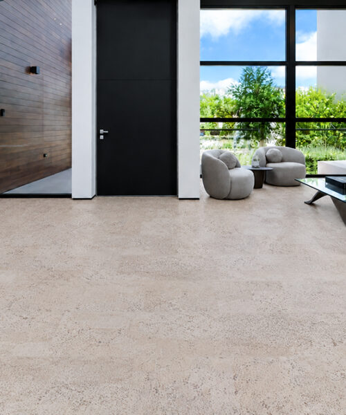 Mystic Vanilla Swiss Real Cork Floating Flooring With Pale Textured Planks In A Contemporary Living Room And Entryway.