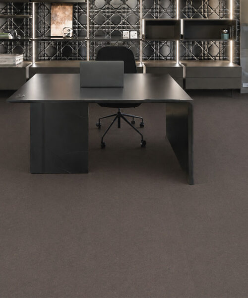 Night Swiss Real Cork Floating Flooring Covers A Modern Office With A Black Desk And Illuminated Shelving.