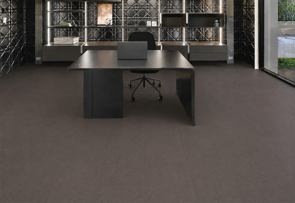 Night - 7/16&Quot; (11Mm) - Swiss Real Cork Floating (Fnig11) Night Swiss Real Cork Floating Flooring Covers A Modern Office With A Black Desk And Illuminated Shelving.