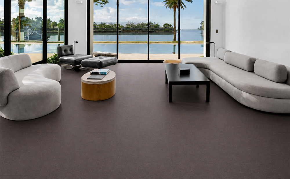 Night - 7/16&Quot; (11Mm) - Swiss Real Cork Floating (Fnig11) Night Cork Flooring For A Living Room Surrounds Curved Sofas And Black Tables Overlooking The Waterfront.
