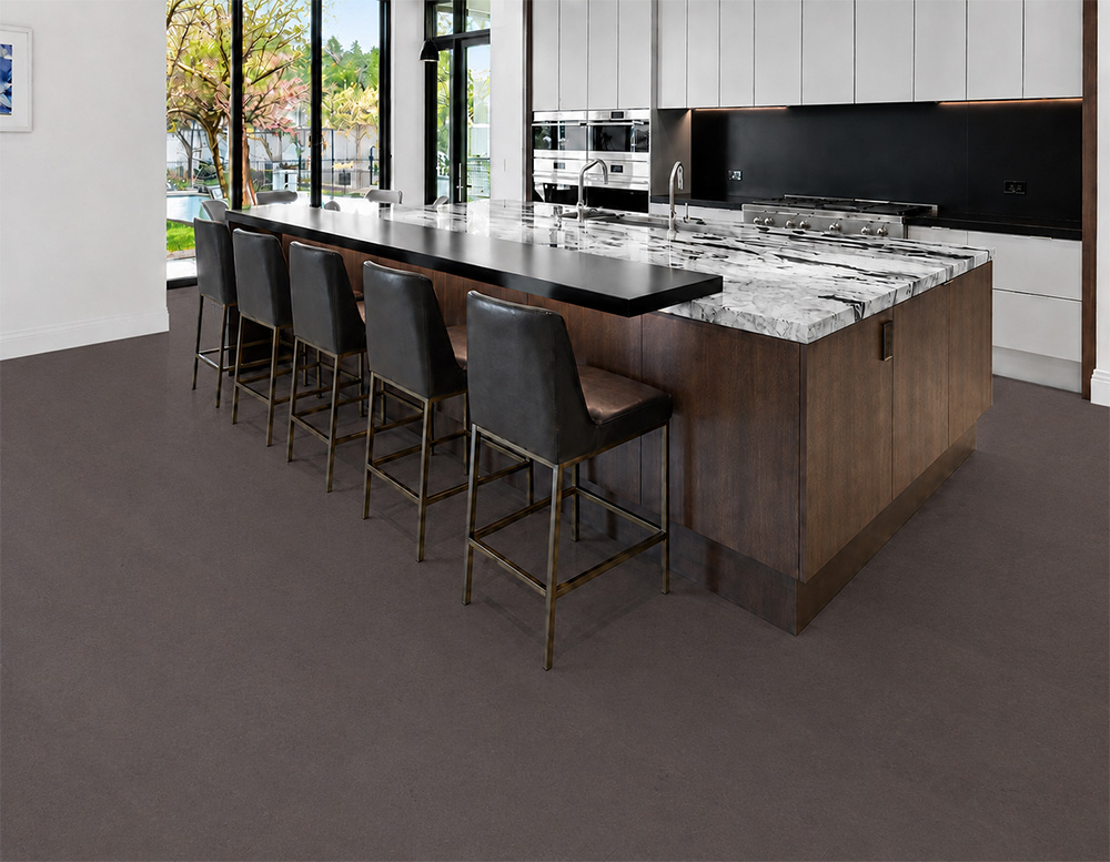 Night - 7/16&Quot; (11Mm) - Swiss Real Cork Floating (Fnig11) Night Black Cork Floor Planks Surround A Marble Island And Dark Bar Stools In A Contemporary Kitchen.