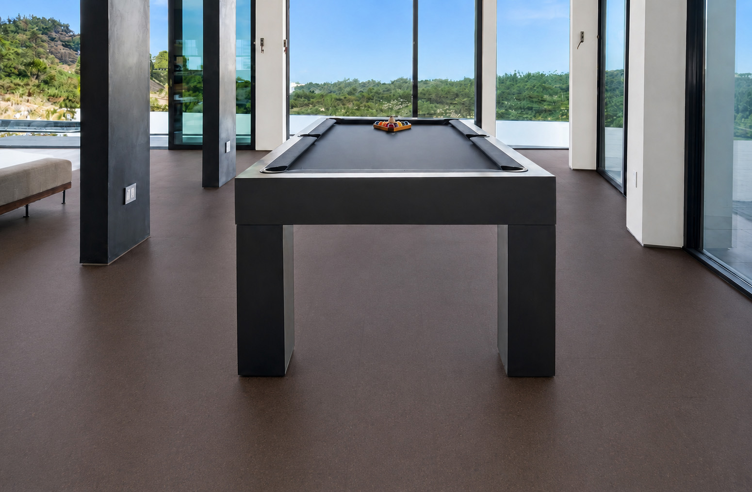 Night - 7/16&Quot; (11Mm) - Swiss Real Cork Floating (Fnig11) Night Black Cork Floor Planks Cover A Modern Game Room With A Pool Table And Mountain Views.
