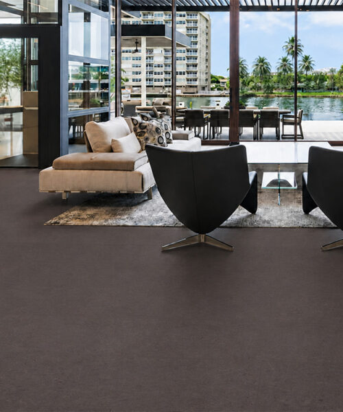 Night - 7/16&Quot; (11Mm) - Swiss Real Cork Floating (Fnig11) Night Dark Floating Cork Flooring Spans A Waterfront Living Room Furnished With Lounge Chairs And A Large Rug.