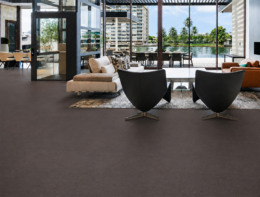 Night - 7/16&Quot; (11Mm) - Swiss Real Cork Floating (Fnig11) Night Dark Floating Cork Flooring Spans A Waterfront Living Room Furnished With Lounge Chairs And A Large Rug.