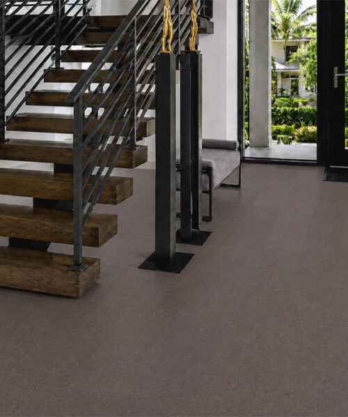 Night - 7/16&Quot; (11Mm) - Swiss Real Cork Floating (Fnig11) Night Floating Cork Flooring Extends Across A Bright Entryway Beside An Open-Riser Wooden Staircase.
