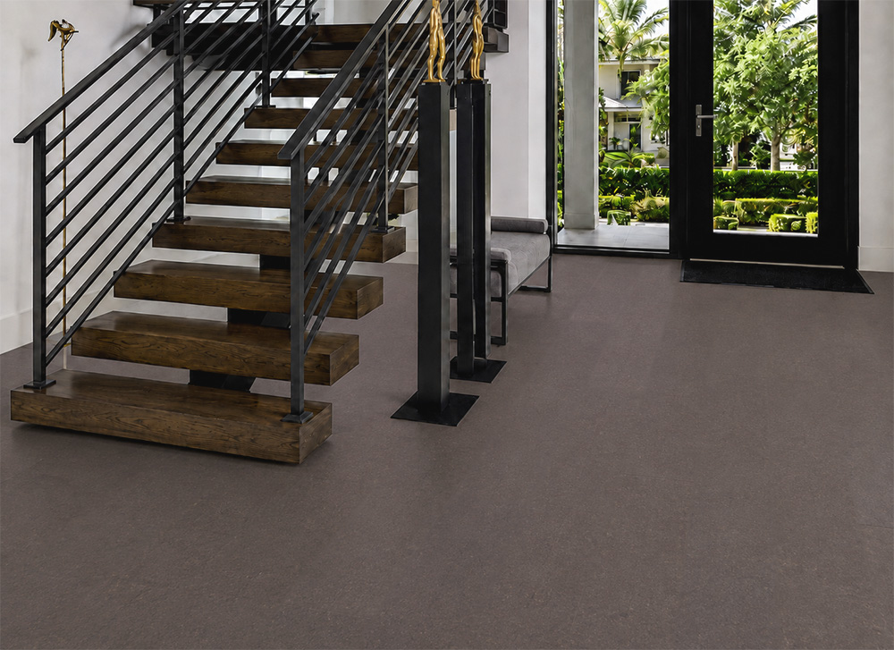 Night - 7/16&Quot; (11Mm) - Swiss Real Cork Floating (Fnig11) Night Floating Cork Flooring Extends Across A Bright Entryway Beside An Open-Riser Wooden Staircase.