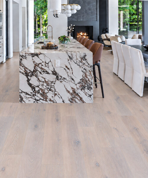 Nordic Oak - 3/8&Quot; (9.5Mm) - Forna Natural Composite Flooring With Waterproof Hydrowood Core (Nnoro9.5) Nordic Oak Scandinavian Wood-Look Natural Composite Flooring Unifies A Marble-Island Kitchen, Dining Room, And Fireplace Lounge.