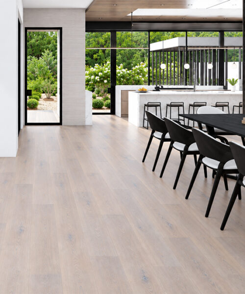 Nordic Oak - 3/8&Quot; (9.5Mm) - Forna Natural Composite Flooring With Waterproof Hydrowood Core (Nnoro9.5) Nordic Oak Waterproof Natural Composite Flooring With Light Oak Grain Extends Through A Garden-Facing Kitchen And Dining Room.