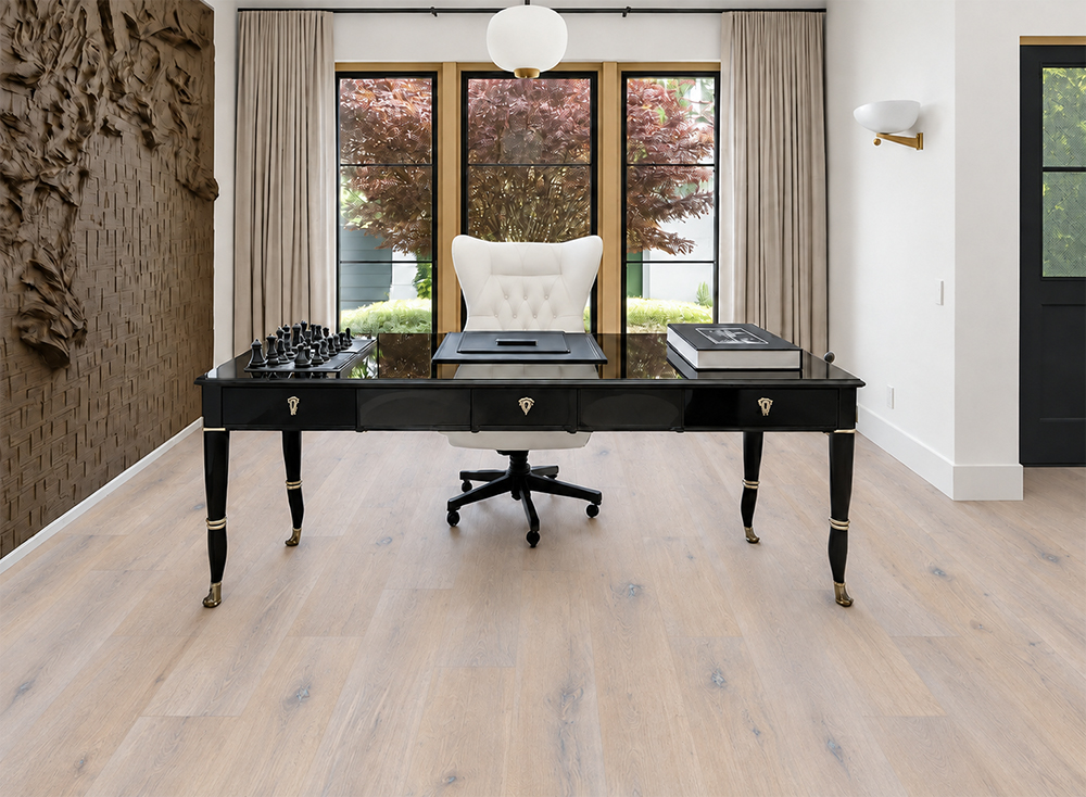 Nordic Oak - 3/8&Quot; (9.5Mm) - Forna Natural Composite Flooring With Waterproof Hydrowood Core (Nnoro9.5) Nordic Oak Swiss-Made Natural Composite Flooring Displays White-Gray Oak Grain Beneath A Black Desk In A Textured-Wall Office.