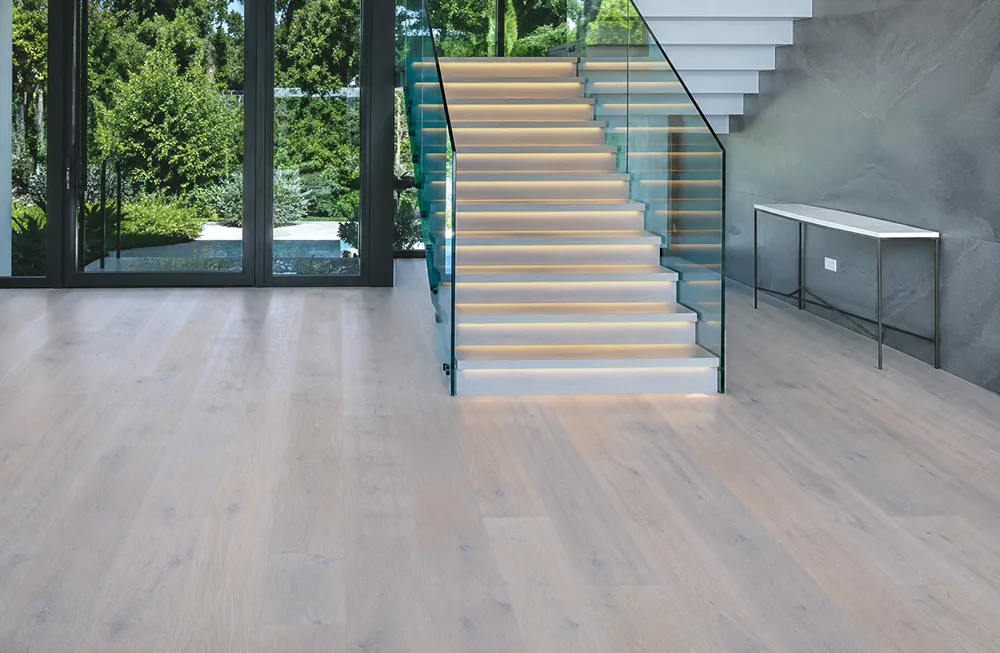 Nordic Oak - 3/8&Quot; (9.5Mm) - Forna Natural Composite Flooring With Waterproof Hydrowood Core (Nnoro9.5) Nordic Oak Natural Composite Flooring In A Modern Entryway With A Glass Staircase And Large Windows