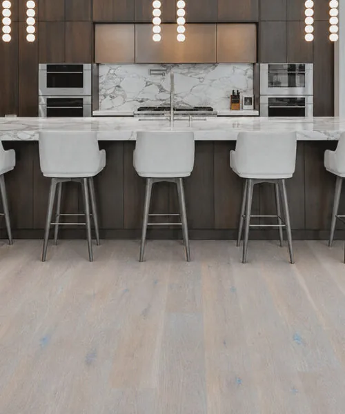 Nordic Oak - 3/8&Quot; (9.5Mm) - Forna Natural Composite Flooring With Waterproof Hydrowood Core (Nnoro9.5) Nordic Oak Natural Composite Floating Floor Installed In A Modern Kitchen With A Large Island And Wide Planks