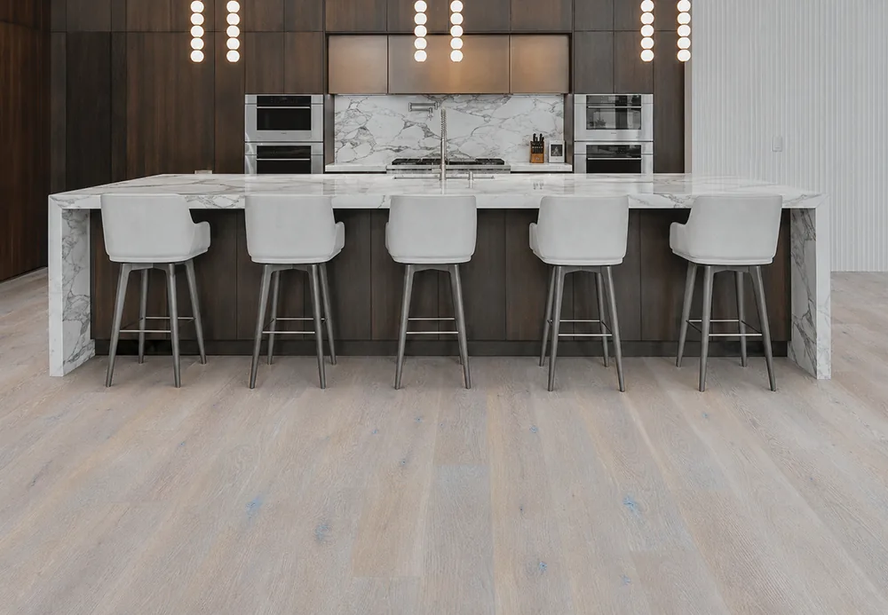 Nordic Oak - 3/8&Quot; (9.5Mm) - Forna Natural Composite Flooring With Waterproof Hydrowood Core (Nnoro9.5) Nordic Oak Natural Composite Floating Floor Installed In A Modern Kitchen With A Large Island And Wide Planks