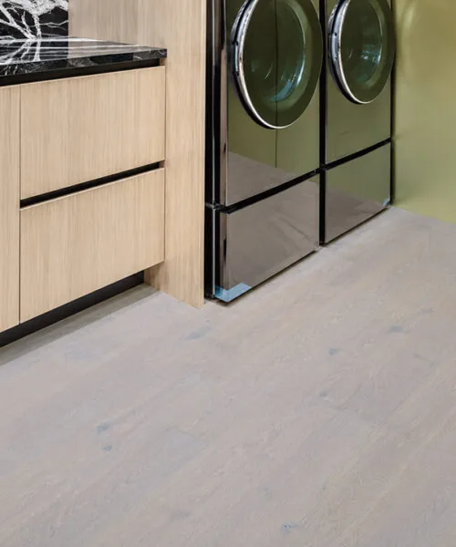 Nordic Oak - 3/8&Quot; (9.5Mm) - Forna Natural Composite Flooring With Waterproof Hydrowood Core (Nnoro9.5) Nordic Oak Natural Composite Flooring In A Modern Laundry Room With Wood Cabinets And Front Load Washers