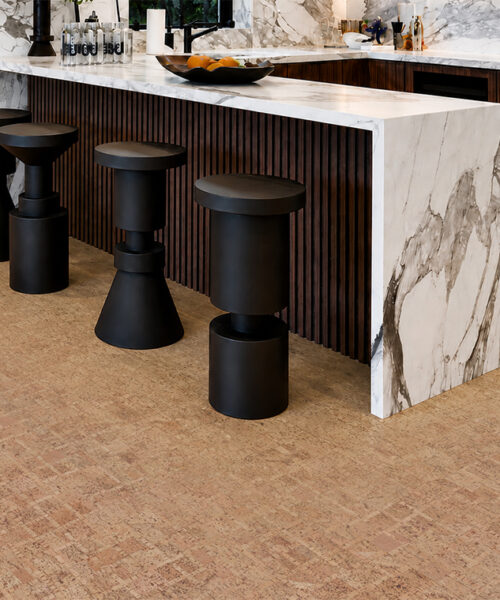 Parcork Swiss Real Cork Floating Flooring In Natural Light Brown Planks Beneath A Marble Kitchen Island.