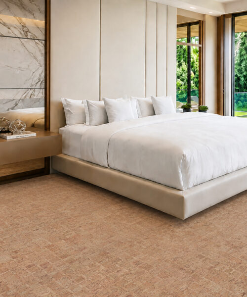 Natural Tan Parcork Cork Flooring For A Bedroom With A White Bed And Wood-Paneled Walls.