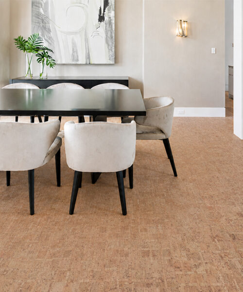 Warm Brown Parcork Cork Flooring For A Dining Room With Upholstered Chairs And Glass Wine Storage.