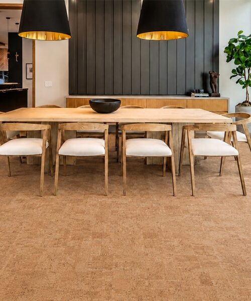 Natural Parcork Cork Floor Planks Complement A Wood Dining Table And Black Pendant Lights.