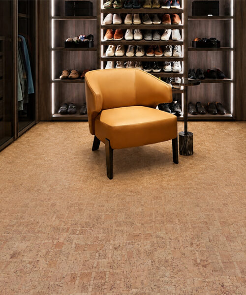 Warm Tan Parcork Floating Cork Flooring With Subtle Linear Texture In A Wood-Paneled Walk-In Closet.