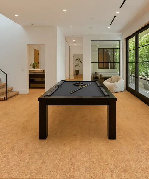 Spacious Game Room With Pool Table And Large Windows Highlighting The Rich Texture Of Quodro Swiss Cork Flooring.