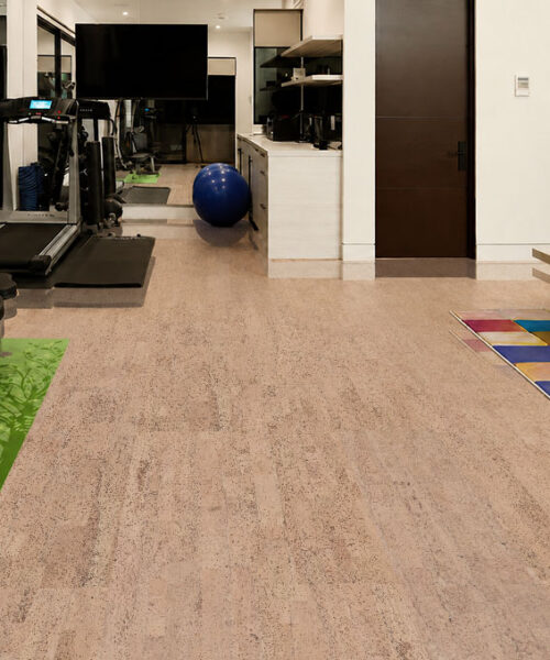 Light beige Rhythm Swiss Real Cork Floating Flooring spans a home gym with treadmill and weight bench.