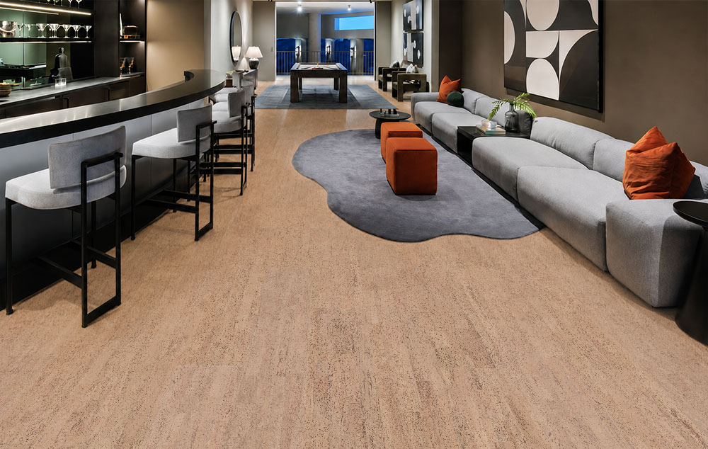 Rhythm – 7/16″ (11Mm) – Swiss Real Cork Floating (Frhy11) Rhythm Floating Cork Flooring Extends Through A Contemporary Bar Lounge With Curved Seating And Orange Ottomans.