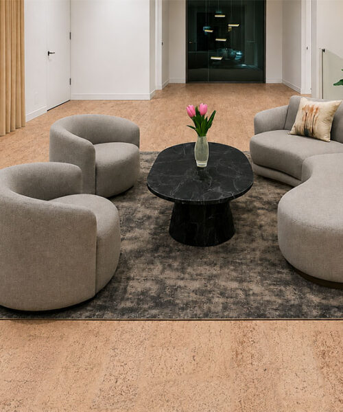 Rhythm – 7/16″ (11Mm) – Swiss Real Cork Floating (Frhy11) Rhythm Eco-Friendly Cork Flooring Surrounds Curved Gray Seating, Black Marble Tables, And Indoor Plants.