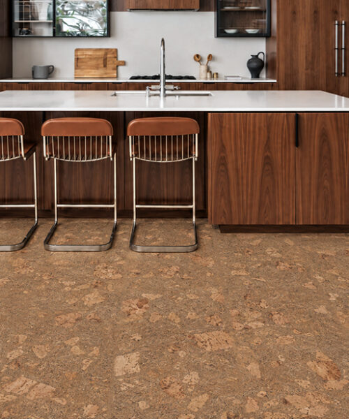 Rococo 12mm amber-brown floating cork flooring complements walnut cabinetry and a white kitchen island.