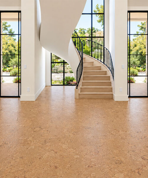 Salami 12mm gold-oak floating cork flooring spans a bright entryway with a curved staircase.