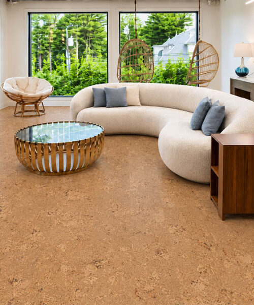 Salami - 1/4&Quot; (6Mm) - Cork Wall Tile Glue Down (Gsal6) Salami Natural Cork Flooring With Chunky Golden Texture Surrounds A Curved Sofa And Hanging Chairs.