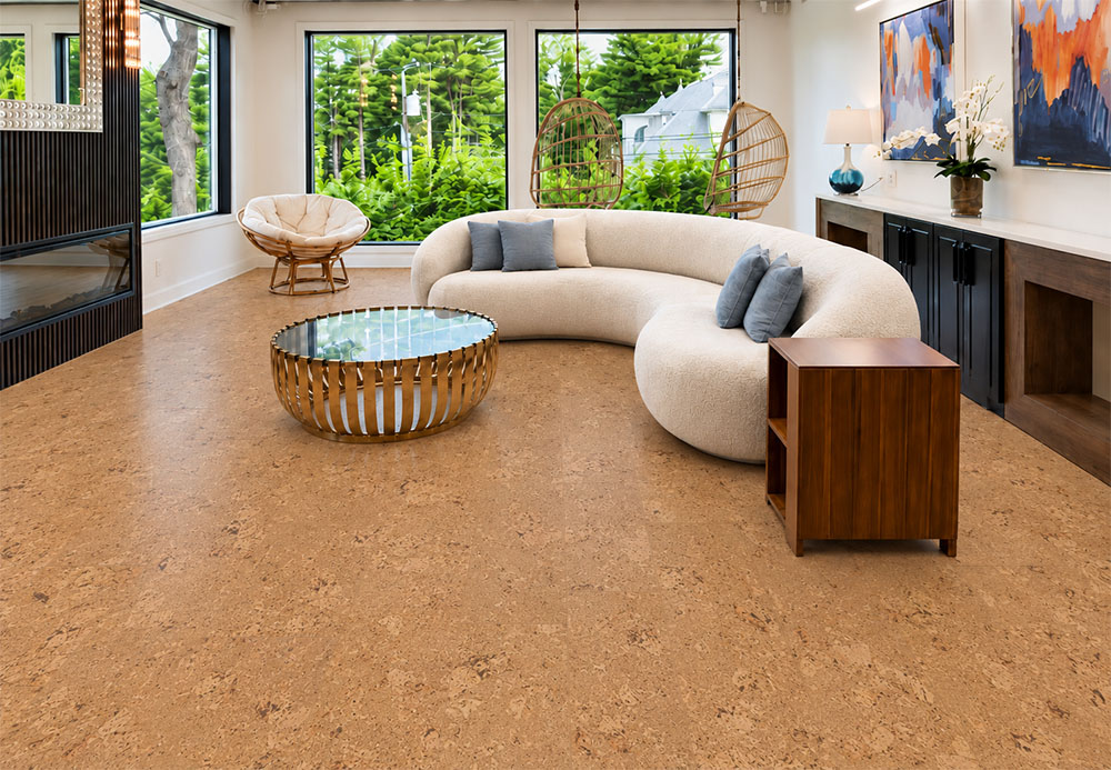 Salami - 1/4&Quot; (6Mm) - Cork Wall Tile Glue Down (Gsal6) Salami Natural Cork Flooring With Chunky Golden Texture Surrounds A Curved Sofa And Hanging Chairs.